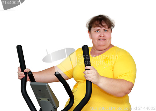Image of overweight woman exercising on trainer
