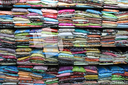 Image of sari on shelves in indian market