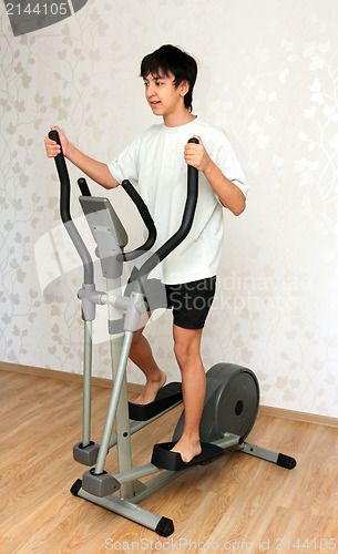 Image of boy exercising on trainer