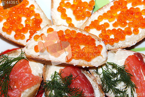 Image of Sandwiches with red caviar and red fish