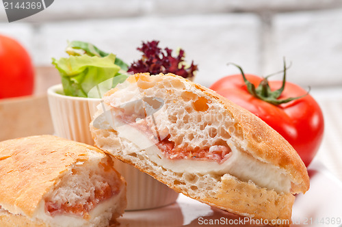 Image of ciabatta panini sandwich with parma ham and tomato