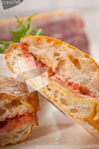 Image of ciabatta panini sandwich with parma ham and tomato