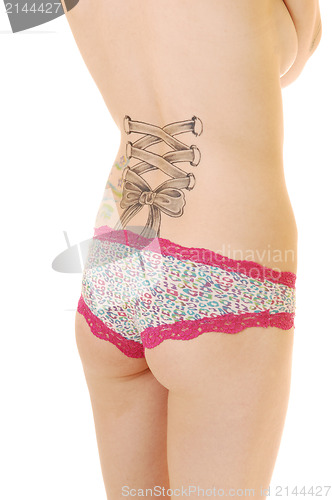 Image of Back of woman with tattoo.