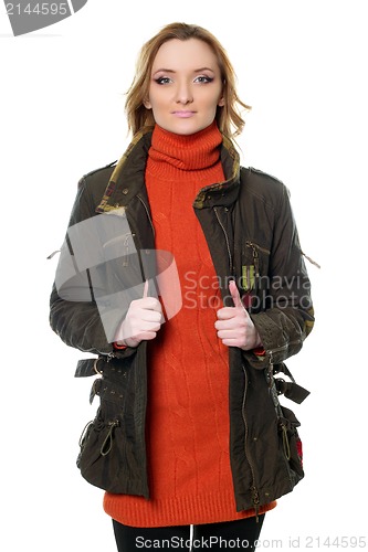 Image of woman in jacket and orange sweater