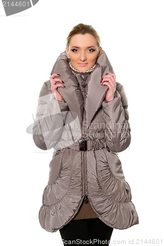 Image of cute young woman in coat