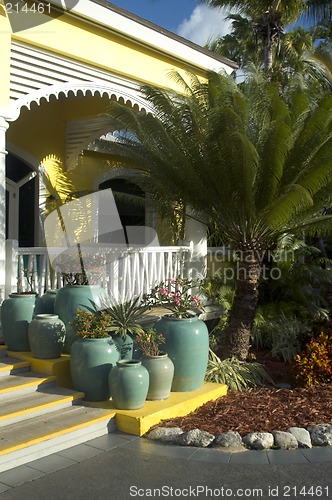 Image of plants in pots in front of hotel