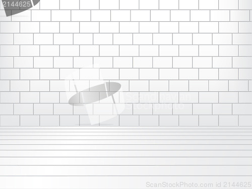 Image of White room with brick wall and wooden floor