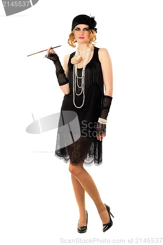 Image of Young woman with a cigarette holder