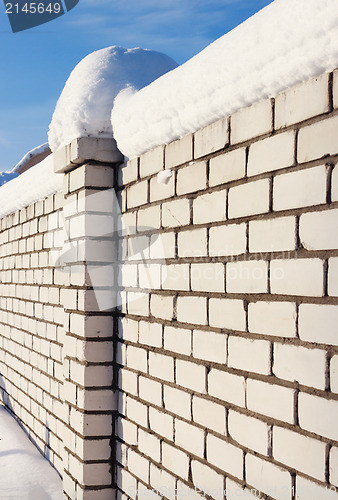 Image of White Brick wall, covered with snow 