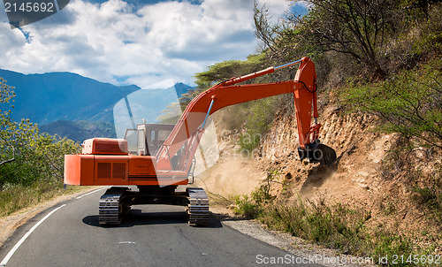 Image of Excavator repair the road.