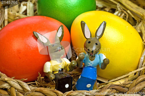 Image of easter basket with painted eggs and bunnies