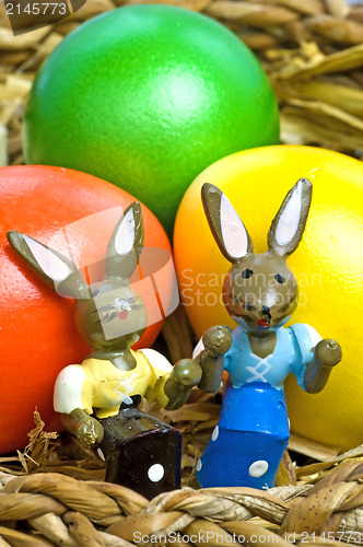 Image of easter basket with painted eggs and bunnies