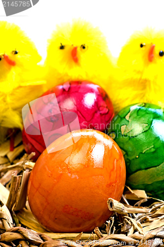 Image of easter basket with painted eggs and biddies