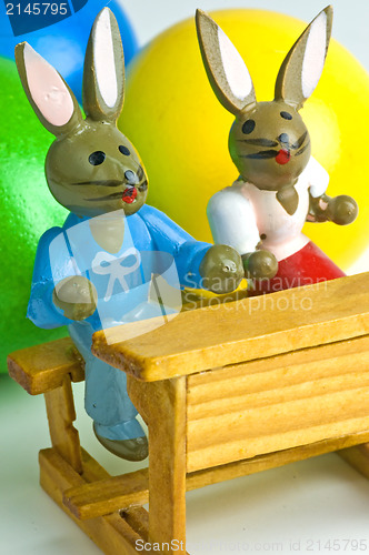 Image of easter basket with painted eggs and bunnies