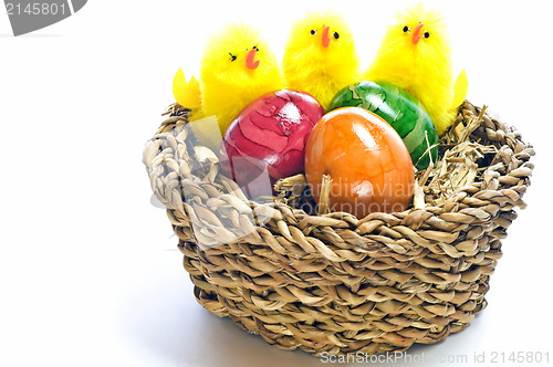 Image of easter basket with painted eggs and biddies