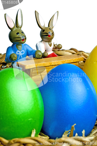 Image of easter basket with painted eggs and bunnies