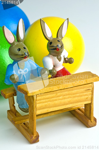 Image of easter basket with painted eggs and bunnies