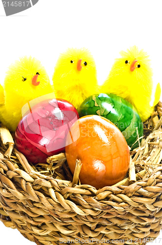 Image of easter basket with painted eggs and biddies