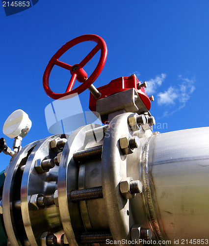 Image of Industrial zone, Steel pipelines and valves against blue sky