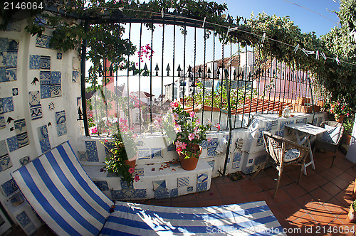 Image of Well designed terrace with flowers