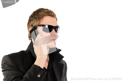 Image of Man in black with a phone