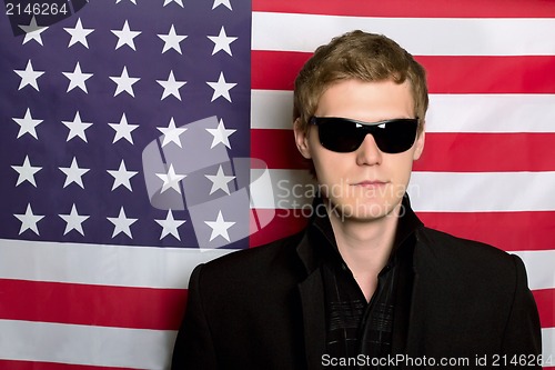 Image of Young man in sunglasses