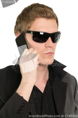 Image of Young businessman with a phone