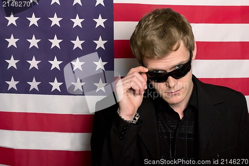 Image of Serious man in sunglasses