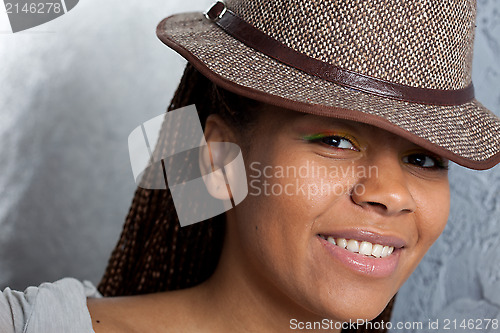 Image of smiling girl in a hat