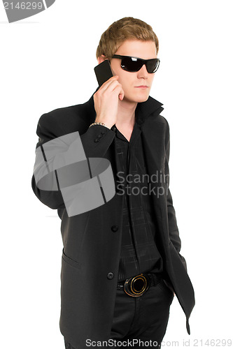 Image of Man in sunglasses with a mobile