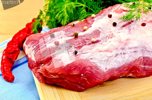 Image of Meat whole piece with spices on the board