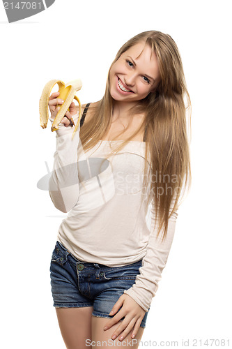 Image of Beautiful woman holding banana