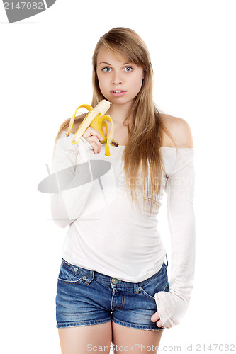 Image of Woman holding banana  