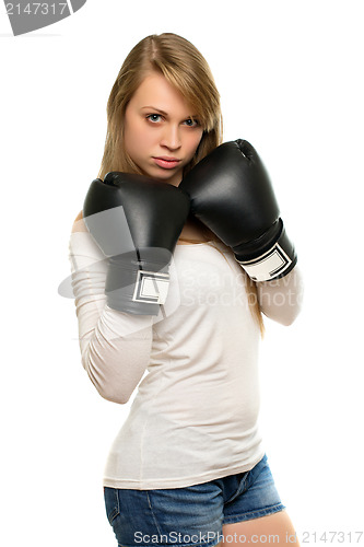 Image of Young woman posing with boxing gloves