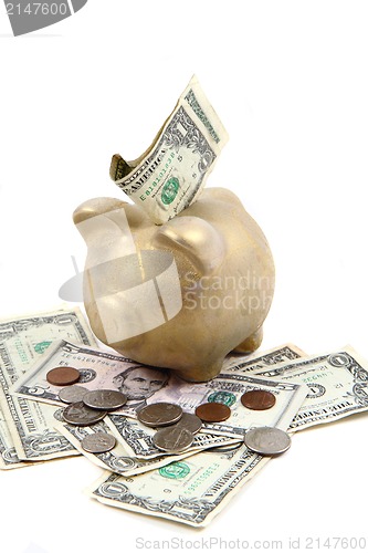 Image of gold pig bank and dollars 