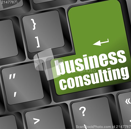 Image of Computer keyboard with business consulting key. business concept