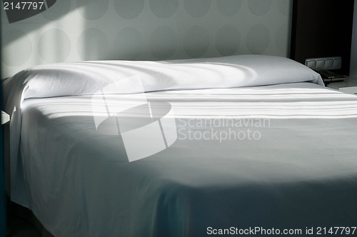 Image of Double bed in apartment