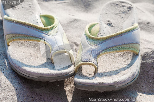 Image of Flip-flops and sand