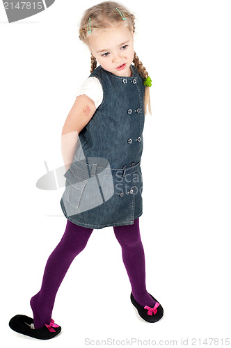 Image of Portrait of cute girl in denim dress