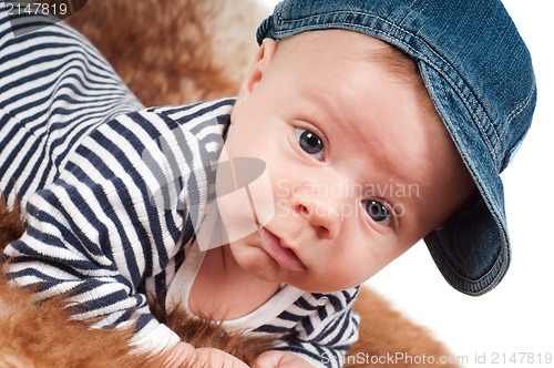 Image of Newborn baby in denim cap