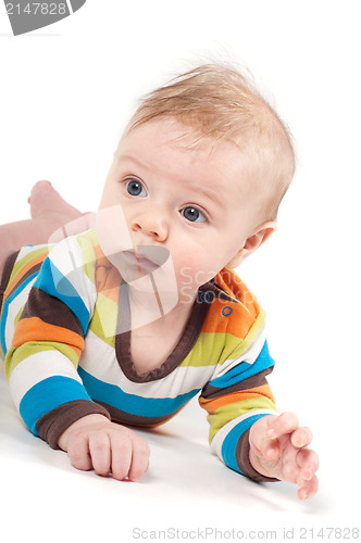 Image of Little baby in multicolored striped clothes