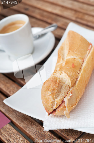 Image of Bocadillo (seranito) and coffe