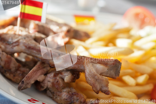 Image of French fries and ribs