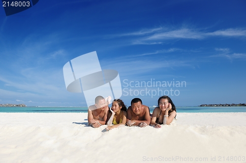 Image of happy young  couple enjoying summer on beach