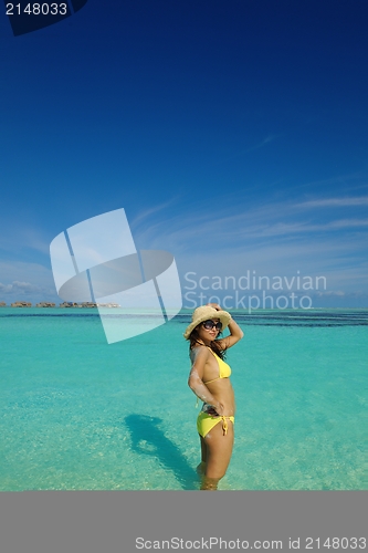 Image of beautiful  woman resting on tropical  beach