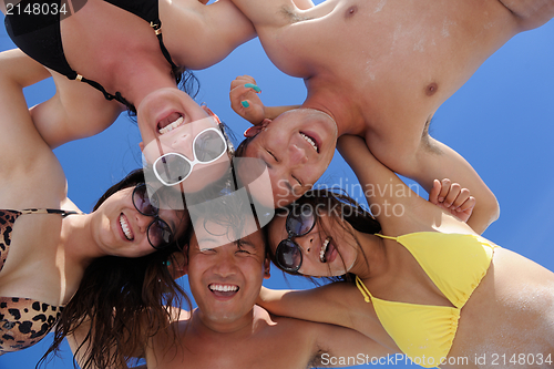 Image of group of happy young people have fun on bach