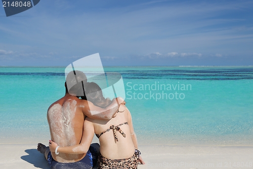 Image of happy young  couple enjoying summer on beach