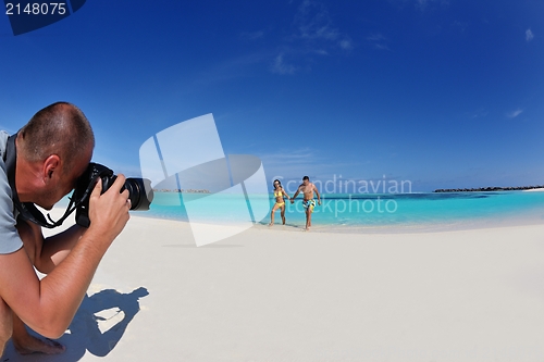 Image of photographer taking photo on beach