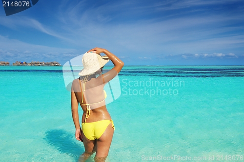 Image of beautiful  woman resting on tropical  beach
