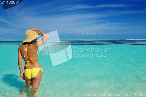 Image of beautiful  woman resting on tropical  beach